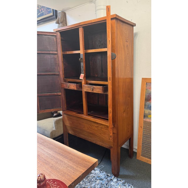 Design Plus Gallery presents an Elmwood Wedding Cabinet of the Qing Dynasty Design. This antique storage piece was crafted...
