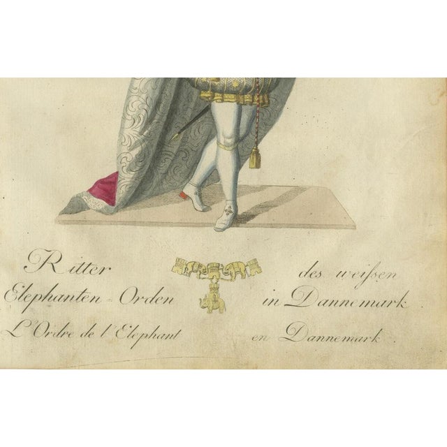 This captivating hand-colored engraving illustrates a "Ritter Elephanten-Orden des weißen in Dänemark" (Knight of the...
