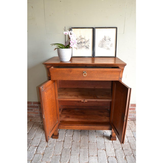 19th-century Dutch oak Empire sideboard, maid's cabinet, commode. The height is 104 cm. The width is 87 cm. The depth is...