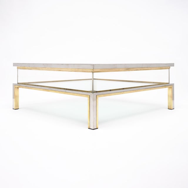 Coffee table from Italy signed by iconic designer Romeo Rega. The striking coffee table features a Lucite incase...