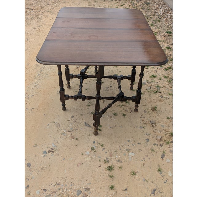 Antique gate leg drop leaf dining table it is sturdy. It is in good condition. This is a unique table and special. Would...