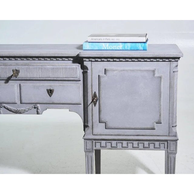 Richly caved sideboard with two doors, circa 100 years oldh. 86 w. 165 d. 48 cmh. 33.8 w. 64.9 d. 18.8 in