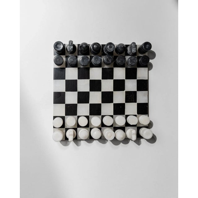 This vintage marble chessboard from the 1960s is a refined example of timeless Italian design. The board is crafted from...