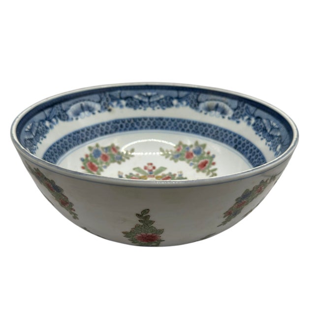 This piece features a classic "crown" silhouette, combining a refined underglaze cobalt blue border pattern along the...