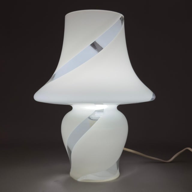An elegant and rare example of 20th-century Italian lighting design, perfect for enhancing sophisticated living rooms or...
