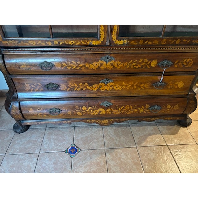 European-style marquetry hutch currently in our possession. It features hand-inlaid detailing, curved drawers, and a glass...