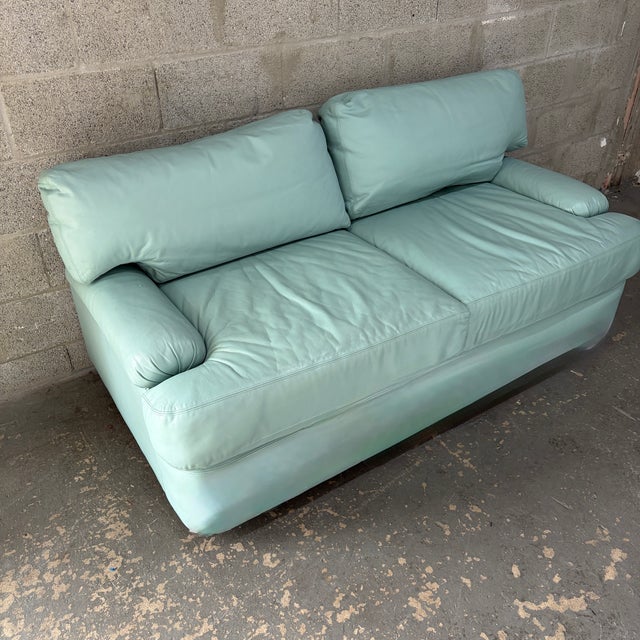 Vintage Postmodern Teal Leather Loveseat by Directional Furniture. Circa 1980s. Features a quintessential 1980s postmodern...