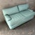 Vintage Postmodern Teal Leather Loveseat by Directional Furniture. Circa 1980s. Features a quintessential 1980s postmodern...