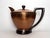 This copper tea pot/kettle from the Mid Century exudes Art Deco design. From clean lines of the silhouette on the kettle...