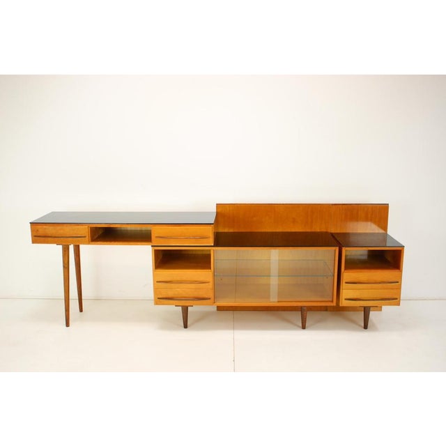 - Wooden veneered construction - Upper surfaces black opaxite glass - Glass bears signs of use, small fragments - Original...