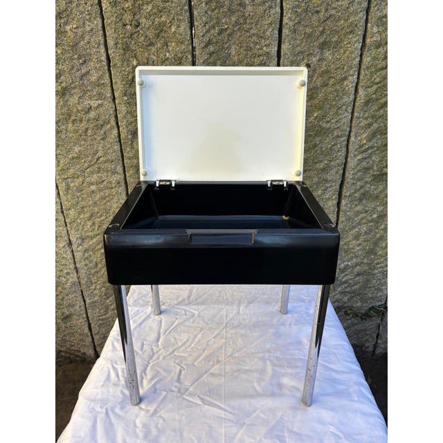 Rare Mod Elba side table/kidney-shaped table from Italy with a white, foldable plastic top on a black frame and chrome-...