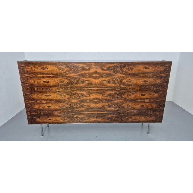 Large sideboard on a chrome-plated square steel frame. According to the previous owner, it was acquired in Switzerland in...