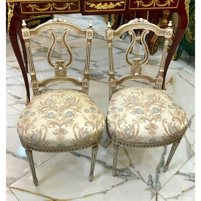 Bring refined French elegance to your space with this matching set of two Louis XVI-inspired side chairs. Each chair...