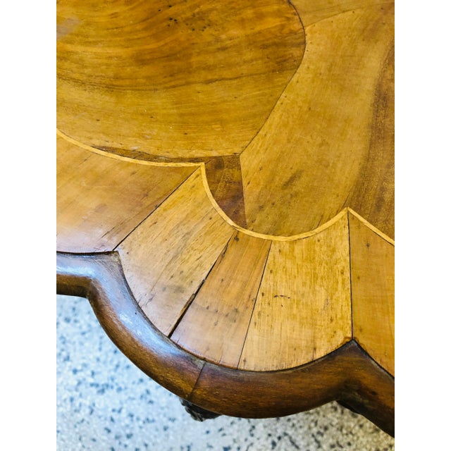 The table has numerous, memorizing inlays and carved elements.