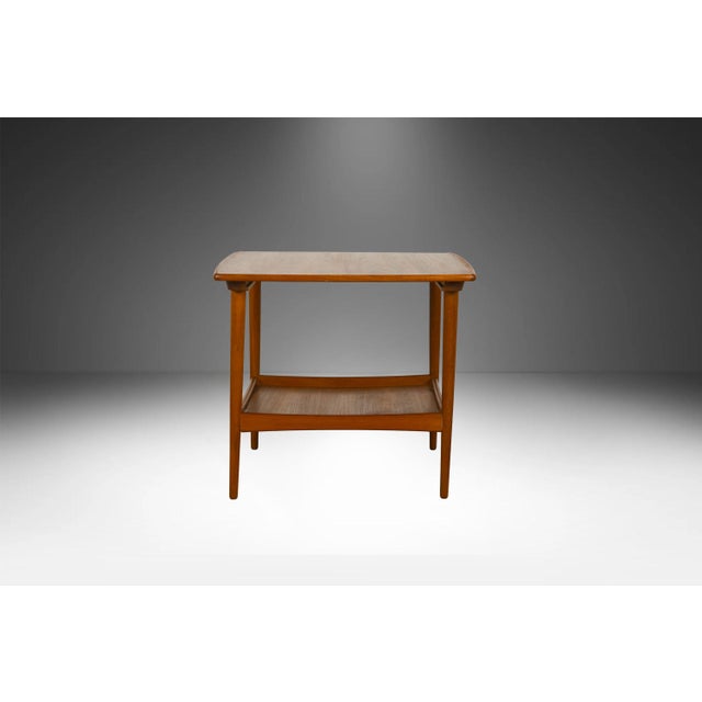 An exceptional 1960s Danish Modern teak side table attributed to Moreddi (Denmark). Renowned for importing high-caliber...