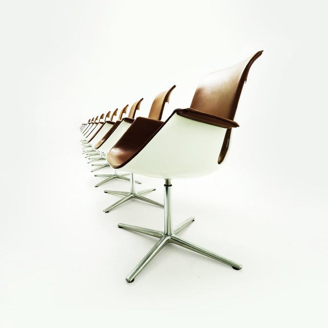 An exceptional limited edition set of 10 danish mid century preben fabricius and jørgen kastlhom fk high back armchairs,...