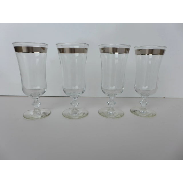 Mid-century set of four stemware/parfait crystal glasses with silver rim in excellent condition.