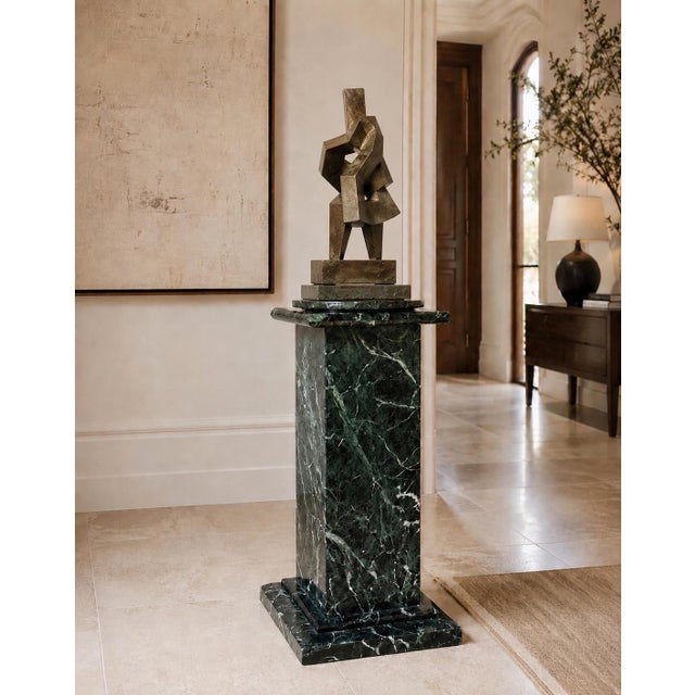 A beautifully crafted custom marble display pedestal, handcrafted by an Italian stone artisan in Los Angeles from richly...