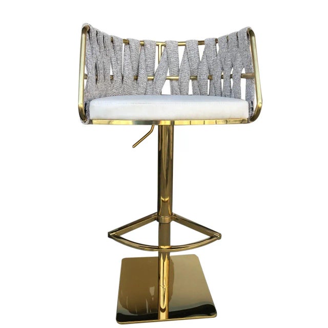 You can use this swivel and adjustable chair at any seat height between 22" and 32". Waived off white fabric is used to...