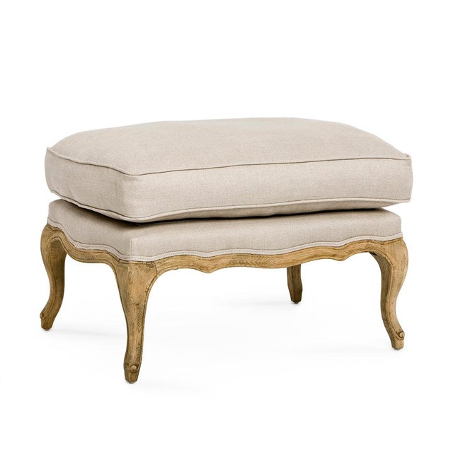 The Bastille Ottoman from Zentique is a French provincial ottoman with a thick loose cushion top in natural linen on an...