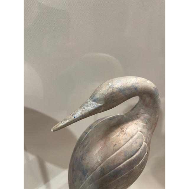 An exceptional pair of authentic 1970s Hollywood Regency stylized crane (or heron) sculptures, beautifully exemplifying...