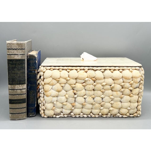 Captivating, vintage shell-covered decorative box, handcrafted with layers of natural seashells arranged in a dense,...