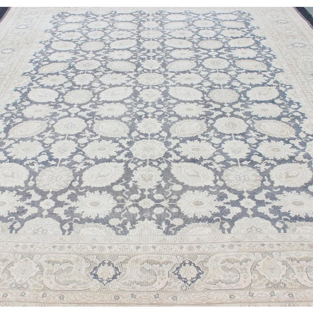 Steel Gray background, tan and gray Tabriz rug from Persia with Repeating Geometric design. Keivan Woven Arts / rug...
