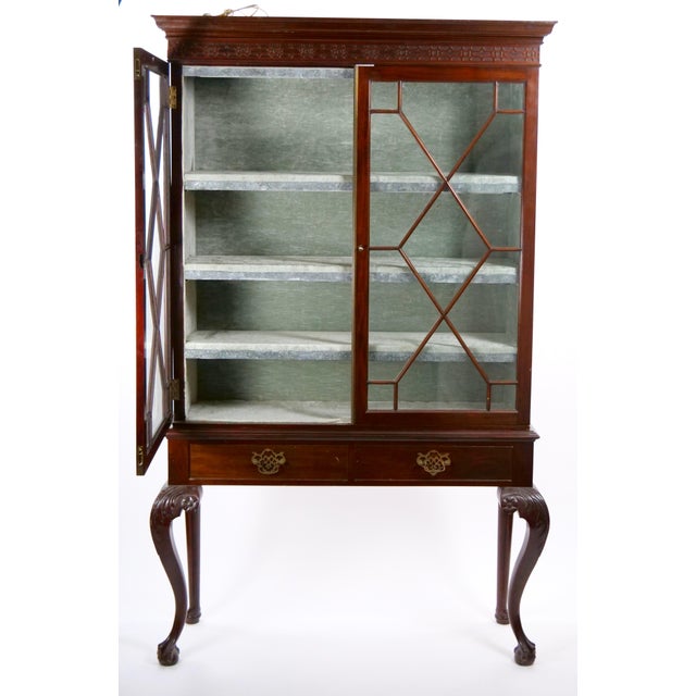 Antique Chippendale style bookcase cabinet on stand, made in England in the early to mid-19th century and finely crafted...