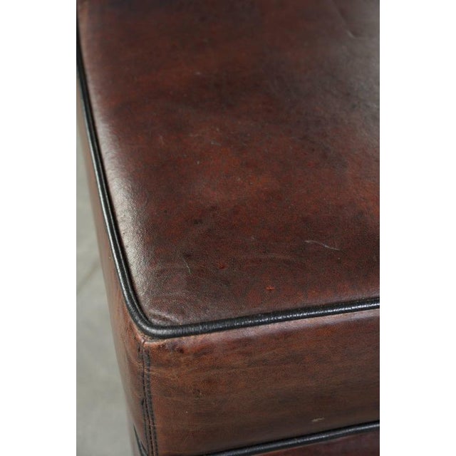 Textile Dark Sheepskin Ottoman with Black Piping For Sale - Image 7 of 10