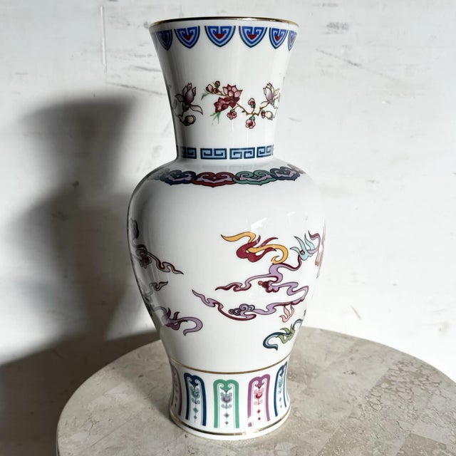 This 1985 Franklin Mint porcelain vase, titled “The Dance of the Celestial Dragon,” showcases richly detailed chinoiserie-...