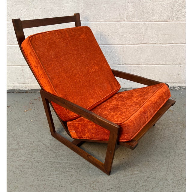 Make a bold Mid-Century Modern statement with this beautifully crafted teak lounge chair. Featuring clean architectural...