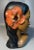 Usher in a bit of Pacific Islands Culture with this sculpted bust of a Polynesian woman. She is hand painted with a coral...