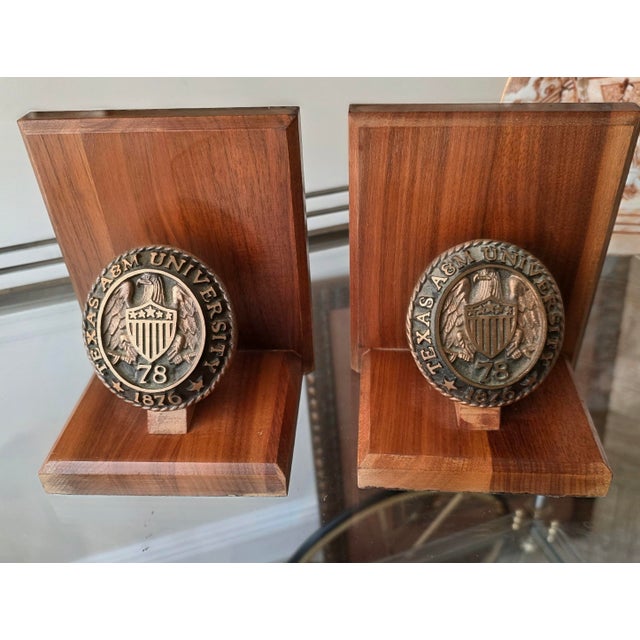 Great looking walnut bookends with metal Plaques with the date Texas A&M was founded 1876 and the then the date for the...