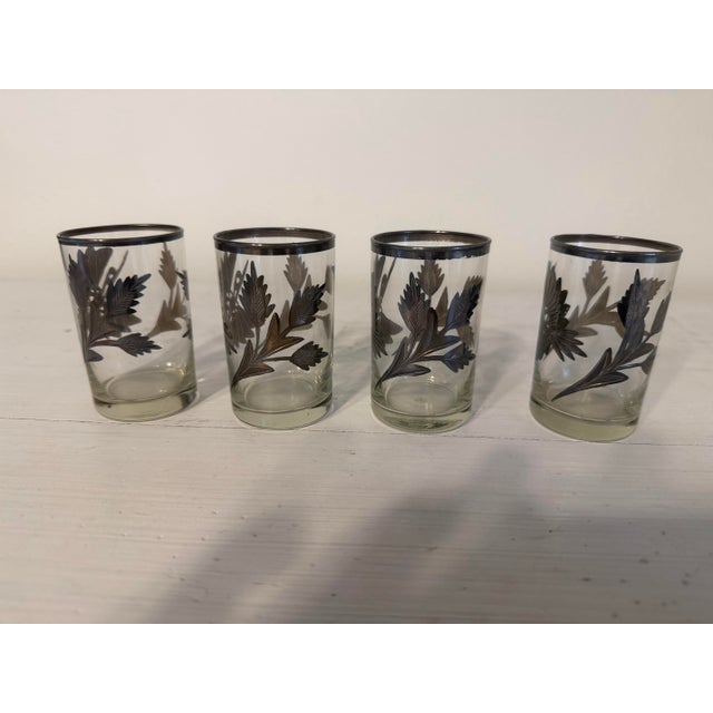 Set of 4 Silver Inlaid Engraved Shot Glasses, 1930s and in very good condition. Hummingbird motif.