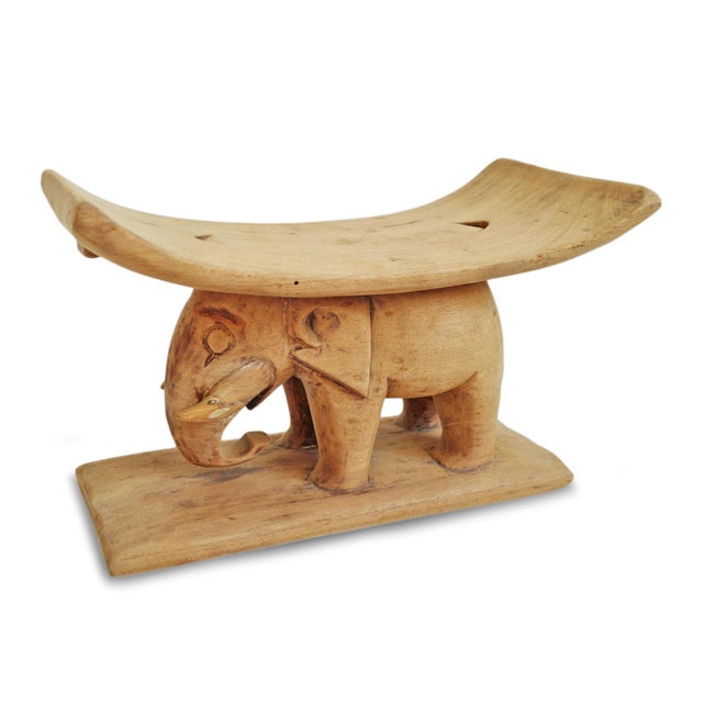 Charming vintage small wood hand carved elephant stool headrest from the Ashanti people of Ghana. Raw wood with natural...