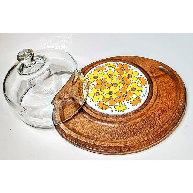 This mid century beauty is from Good Wood, of Thailand teak made in Japan. The tiled cutting board is of a vivid boho...