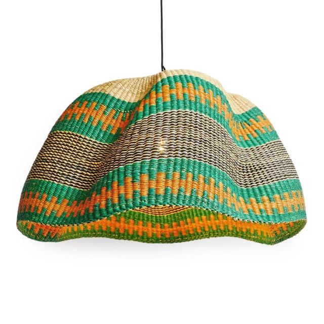 Hand dyed grass green, orange, navy and natural hand woven grass basket lamp. Unique and striking piece with hand woven...