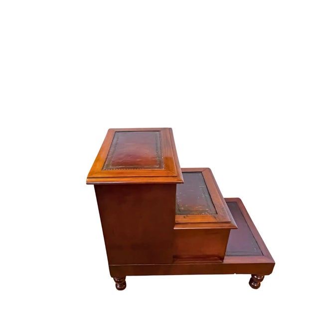 Beautifully crafted English library steps in mahogany with inlaid leather accents. Features two compartments for...