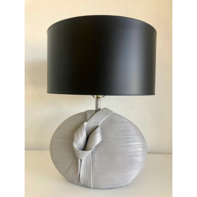 Now available: Pair of Postmodern sculptural 1980's pottery laps with a draped ribbon motif, great texture through out the...