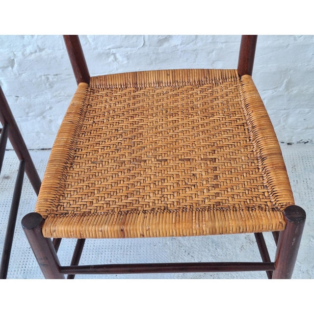 Finely designed set of 4 teak chairs with cane seats and backs patinated to a beautiful golden colour\. The chairs have...