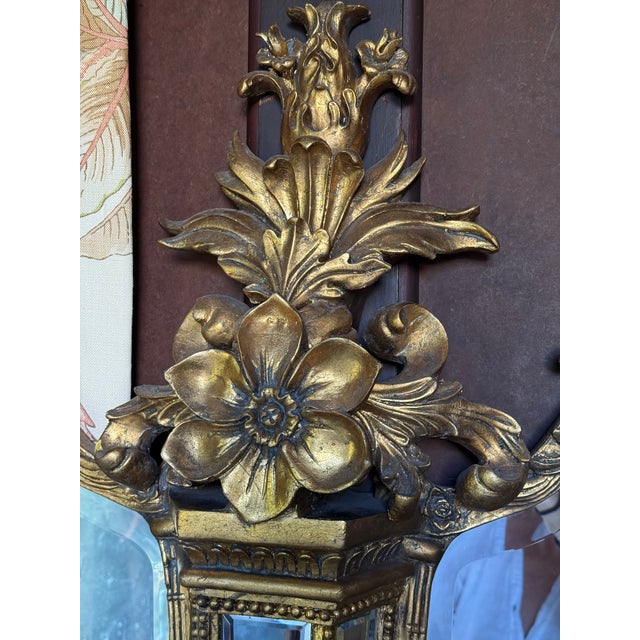 A rare find! This exquisite Rococo Revival (Louis XV Style) girandole mirror features an intricate triptych layout...