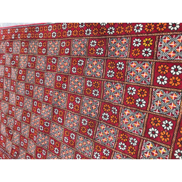 Nice vintage Moroccan rug with a beautiful tribal design and red field color, Mid 20th century, entirely hand knotted with...