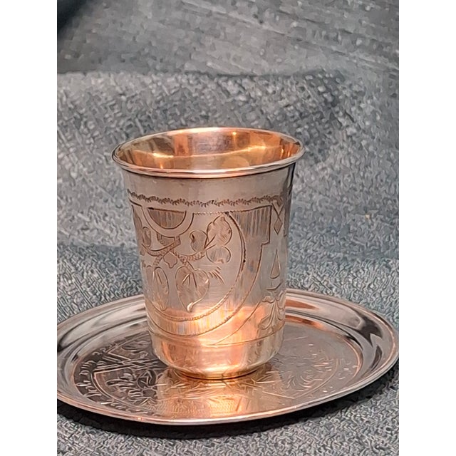 This exquisite antique Imperial Russian silver kiddush cup and matching saucer form a beautiful matched pair of Judaica,...
