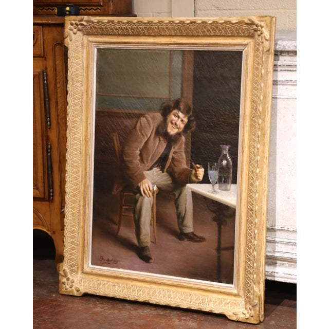 Brimming with personality and narrative charm, this antique genre painting is an original oil on canvas by listed Belgian...