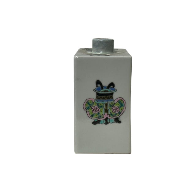 This rectangular porcelain box, likely a brush washer or small caddy, features a crisp white glaze decorated with the...