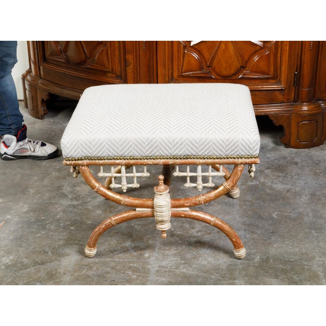 An English Chinese Chippendale style faux bamboo stool with X-Form base and new upholstery. Created in England, this stool...