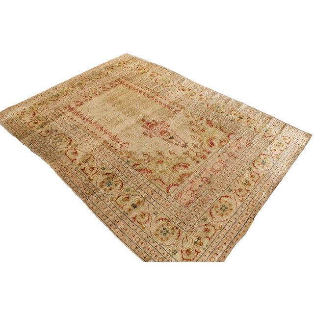 Originating from Persia between 1890-1910, this antique Tabriz rug enjoys a rare, finely hand knotted series of mirrored...