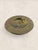 An antique English brass wall charger dating to circa 1920, featuring an embossed repoussé profile of a Renaissance-style...