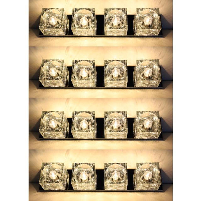 This can be hung as sconce or as a ceiling lights. One of his more famous designs, Murano glass block cubes that create...