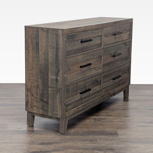 This Crown Mark dresser features a stylish rustic wood finish and six spacious drawers with modern black handles. Its...